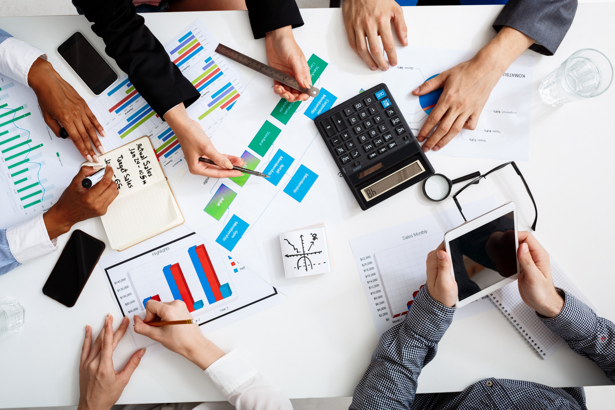 businessmen-hands-white-table-with-documents-drafts